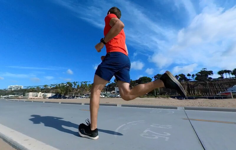 Photograph of the author mid-run during a Cooper Test, showing maintenance of steady pacing despite demanding effort during the test.